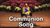 Billy Hester sings a communion song at the Christmas Eve service